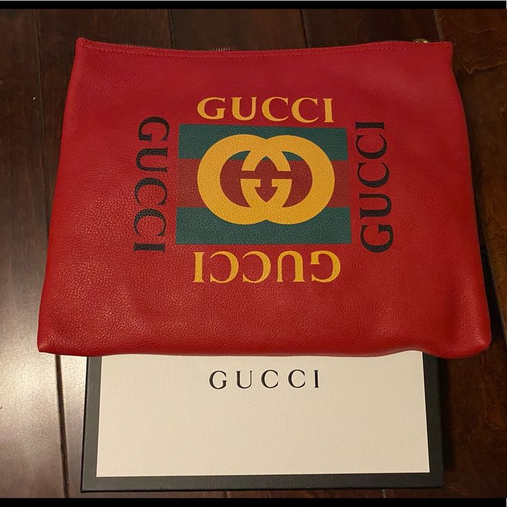 A Pouch Makes For A Great Travel Accessory. This Gucci Pouch Is Crafted From Red Leather And Styled With The Logo On The Front. The Zip Top Closure Opens. Designer Shopping Clutch Pouch, Designer Clutch Pouch For Shopping, Designer Pouch Clutch For Shopping, Gucci Designer Wallets With Logo, Designer Gucci Wallets With Logo, Designer Red Wallet For Daily Use, Red Designer Wallets For Daily Use, Gucci Red Bag With Removable Pouch, Luxury Gucci Wallet With Logo