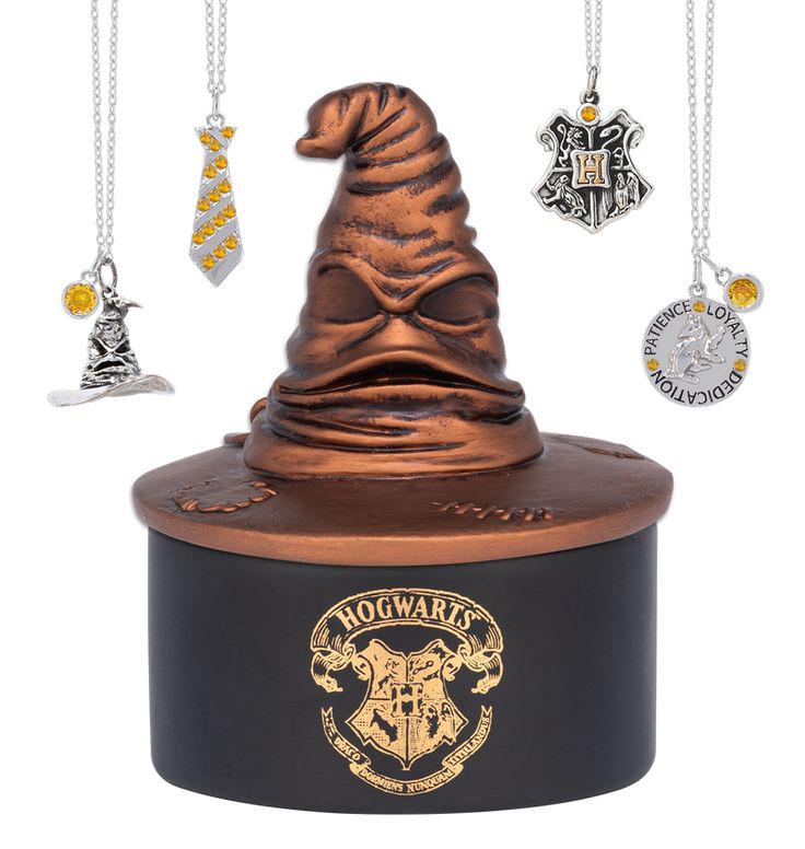 a harry potter hat with five charms hanging from it's top and the words hogwart