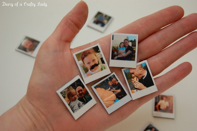 a person's hand holding several small polaroids with photos on them, all in different shapes and sizes