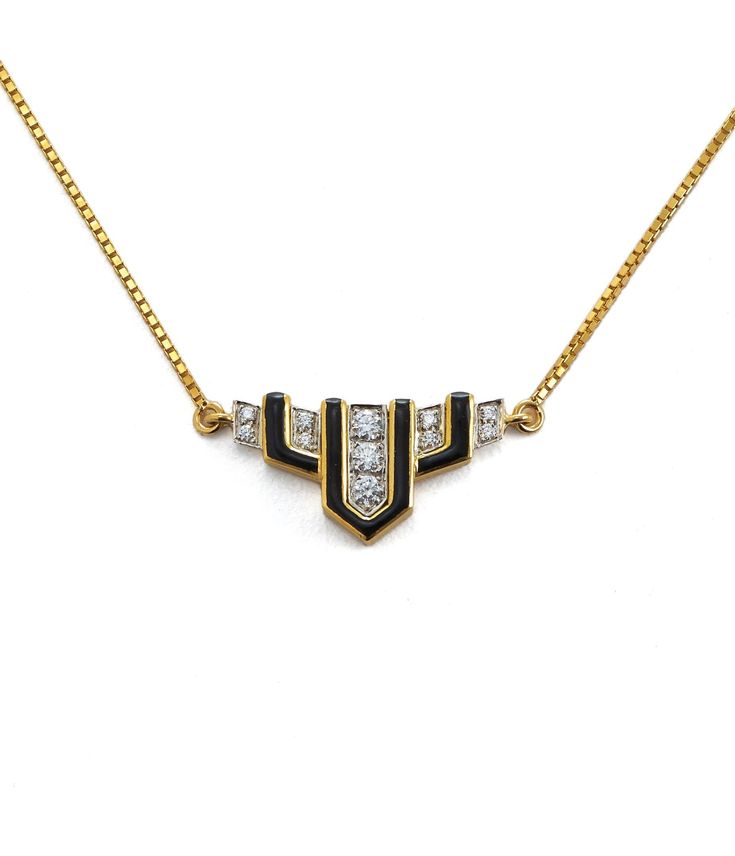 Brilliant-cut diamonds, black enamel, 18K gold, and platinum, on an 18K gold chain Available in black enamel and white enamel. Art Deco Necklace With Diamond Accents, Fine Jewelry White Gold Necklace With Black Enamel, Art Deco Diamond Necklace With Accents, Luxury Black Diamond Pendant Necklace, Luxury Black Chain Necklace, Art Deco Diamond Necklace In Yellow Gold, White Gold Pendant Necklace With Black Enamel, Elegant Yellow Gold Necklaces With Black Diamonds, Art Deco White Gold Necklace For Evening