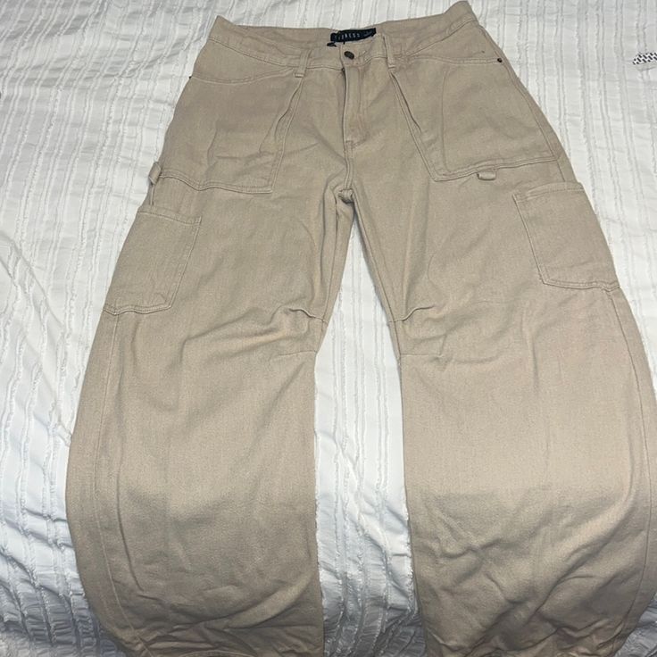 Never Worn! Fits Size 6-8 Very Long Pants Baggy High Rise Utility Bottoms, Beige Wide Leg Cargo Pants With Five Pockets, Beige Five Pocket Pants For Streetwear, Baggy Mid-rise Utility Bottoms, Beige Five-pocket Pants For Streetwear, Beige Streetwear Pants With Five Pockets, Casual Beige Mid-rise Bottoms, Beige Straight Leg Pants With Multiple Pockets, Baggy Beige Bottoms With Multiple Pockets