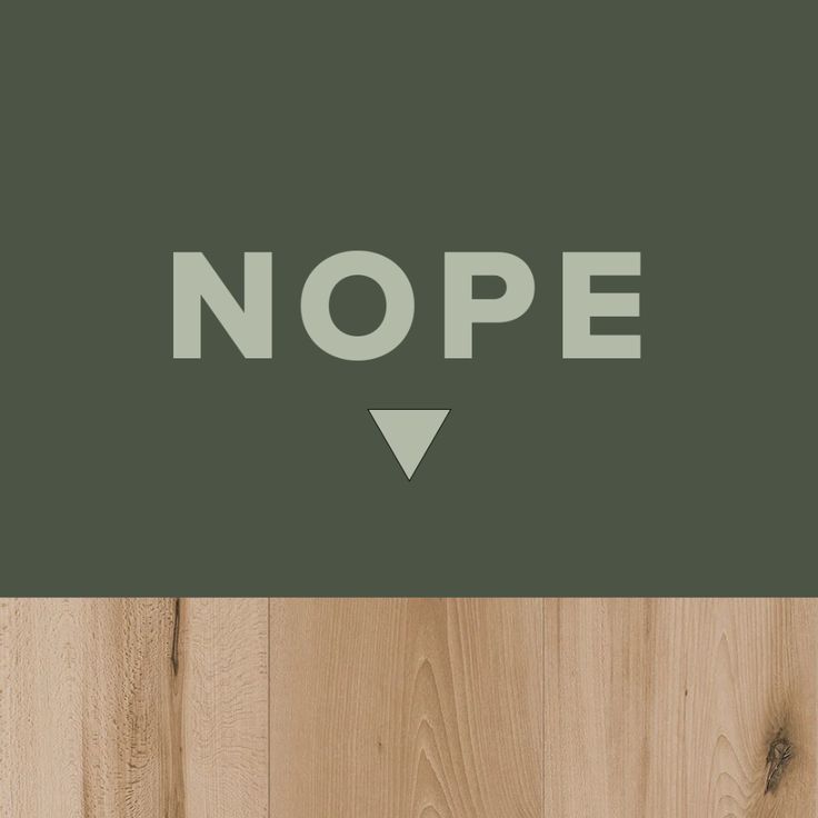 the words nope are placed on top of wood planks with an arrow pointing to it