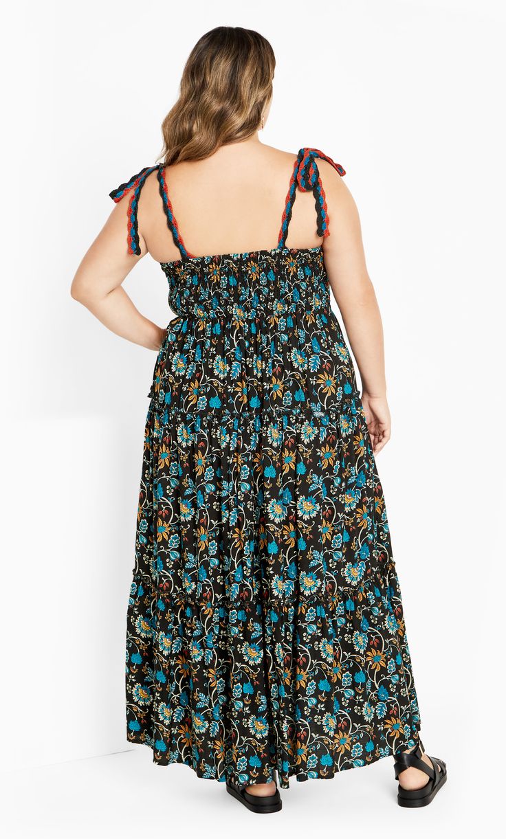 Say hello to your new summer obsession - the Candice Maxi Dress is here to slay! Featuring a shirred back and tiered skirt, it's perfect for twirling under the sun or hitting the dance floor, while the pull-over style ensures effortless style with every wear. Key Features Include: - Square neckline - Adjustable tie straps - Embroidered front - Shirred back - Tiered skirt - Pull over style - Maxi length Team with sneakers and a denim jacket. | Plus Size Maxi Candice 26 in Black, Size 26/3XL | City Chic | Plus Size Maxi Dress Candice 26 in Black, Size 26/3XL | City Chic Sleeveless Smocked Dress With Gathered Skirt For Summer, Black Maxi Dress With Tie Straps For Vacation, Beach Black Maxi Dress With Tie Straps, Black Maxi Dress With Tie Straps For Beach, Flowy Gathered Skirt Dresses For Vacation, Multicolor Gathered Skirt Summer Dress, Multicolor Gathered Skirt Dress For Summer, Black Sundress With Smocked Back For Vacation, Multicolor Summer Dress With Gathered Skirt