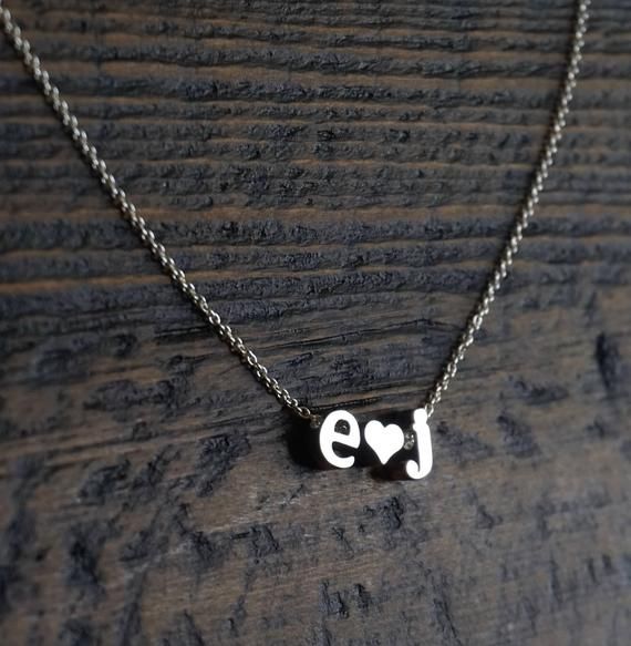 Personalized letter necklace- Couples Initials Necklace, Tiny letter necklace, Couples necklace, Gift for girlfriend, Valentine's Day Gift, Minimal Necklace, personalized necklaceFeatures:--------------- rhodium plated charms (hearts and letters)- lowercase block letters- sterling silver chainPersonalize this adorable necklace with you and your loved one's initials.  Pick the 2 initials from the drop down menu and let me know the length of the chain, up to 19 inches at no additional cost.Dimensi Personalized Name Necklace For Anniversary, Engraved Initial Necklace For Mother's Day Anniversary, Engraved Initial Necklace For Anniversary On Mother's Day, Initial Pendant Charm Necklace For Anniversary, Personalized Heart Pendant Initial Necklace For Anniversary, Initial Necklace For Valentine's Day Anniversary Gift, Personalized Couples Necklaces For Anniversary, Personalized Charm Necklace For Mother's Day Anniversary, Personalized Couples Necklaces For Mother's Day