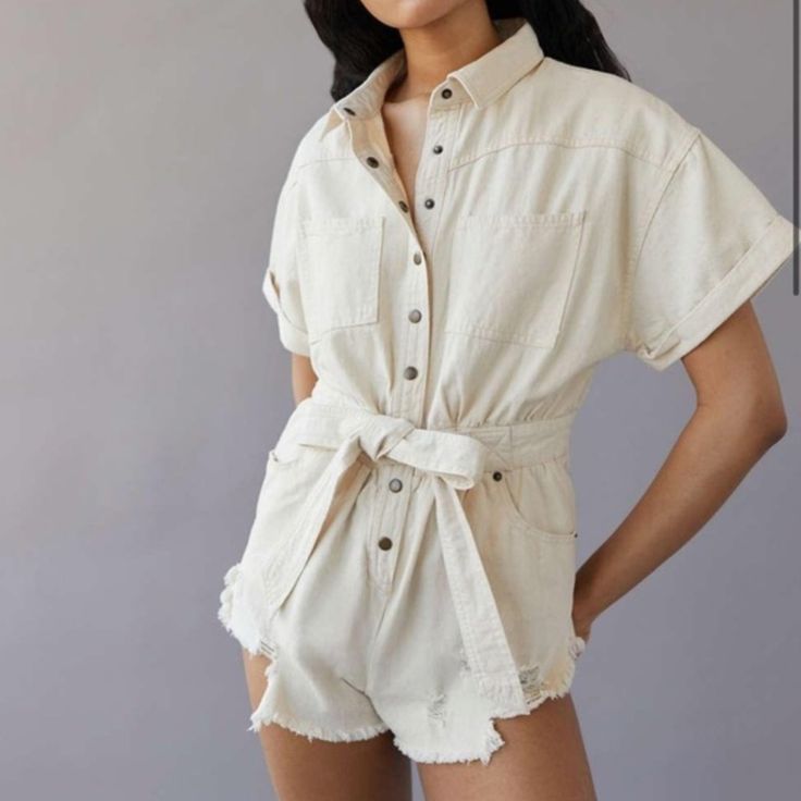 New With Tags Urban Outfitters Bdg Distressed Denim Romper Cream Color Size X Small Waist: 27" Inseam: 1.75" An Effortless Romper From Bdg. Cut Short. Button Placket At The Front. Finished With A Fabric Belt At The Waist And Distressed Hems. Summer Cotton Denim Jumpsuit With Button-up, Chic Cotton Denim Jumpsuit With Relaxed Fit, Cotton High-waist Jumpsuits For Day Out, Cotton High-waist Jumpsuits And Rompers For Day Out, Cotton High Waist Jumpsuits For Day Out, Cotton High Waist Jumpsuits And Rompers For Day Out, High Waist Cotton Jumpsuits And Rompers For Day Out, Cotton High-waisted Denim Jumpsuit For Day Out, Chic Cotton Button-up Denim Jumpsuit