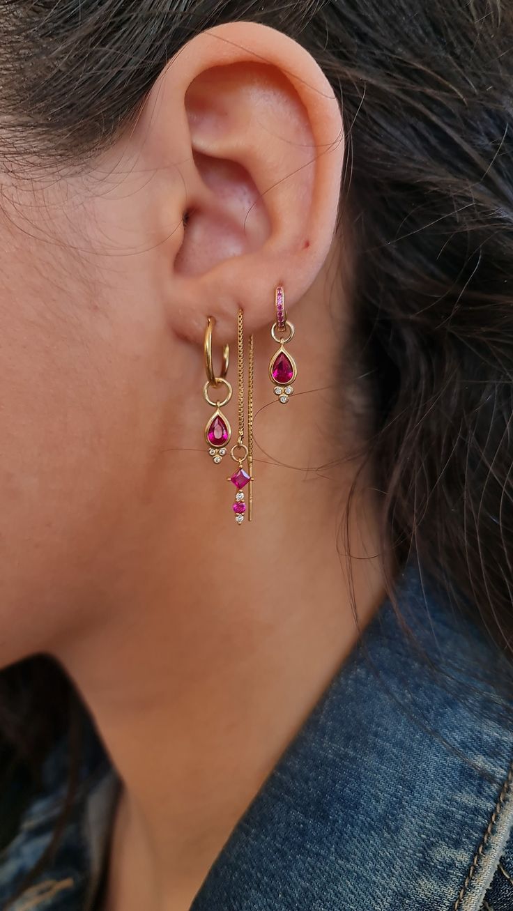 ▪  A Triple Earrings set full of chic and style, made of brass plated gold 2MICRON (HIGH QUALITY), Decorated with a Ruby Swarovski zircon, cross & Drop charms.    The set is made of three parts.    Earring No 1 - Hoop Drop earring     Earring no 2 - Threader Earring with a cross.    Earring No 3 - small Hoop Ruby Swarovski zircon with Drop charm.     ▪  Threader Earrings, Crystal Hoop Earring, Minimal Stacking Earring, Ruby Gemstone Huggie Earring, Drop Hoop Earrings, stacker earrings  Threader Cute Hoops Earrings, Set Of 3 Earrings, Earring Sets Gold, Gemstone Huggie Earrings, Pink Ear Curation, Minimal Earring Stack, Three Earring Stack, Gold Stacked Earrings, Earing Stack Gold