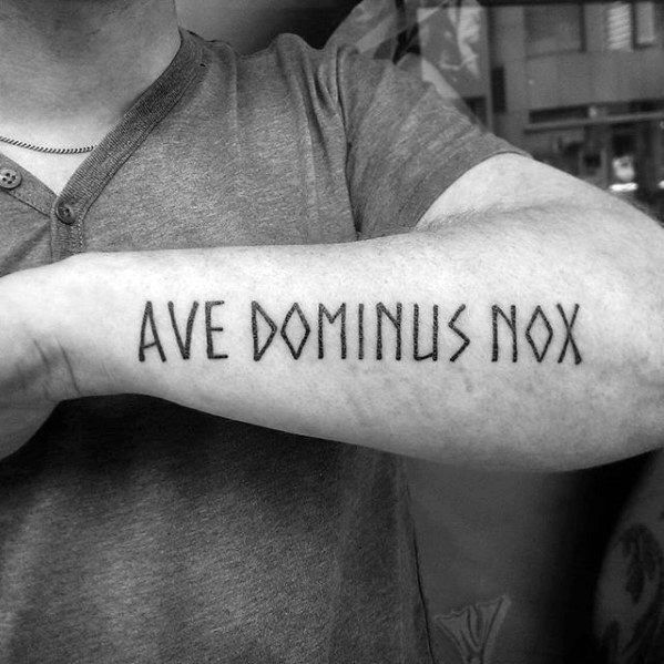 a man with a tattoo on his arm that says, ave domius nox