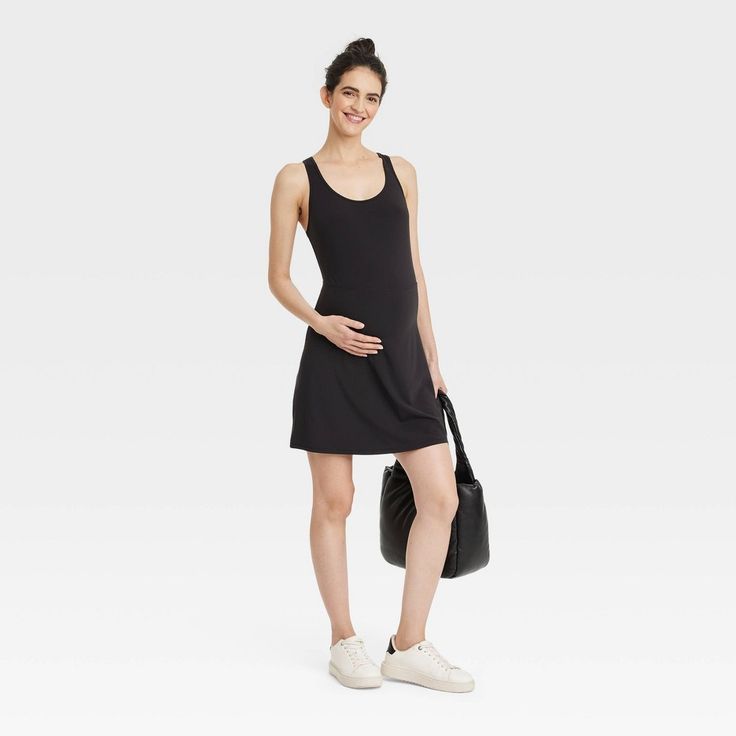 Sport cool, comfy style during baby showers or running errands wearing this Sleeveless Midi Active Dress from Isabel Maternity By Ingrid & Isabel™. This sleeveless active dress is tailored in a midi length to give you a stylish look, and it features built-in shorts for extra coverage. The soft, stretchy jersey fabric offers cool comfort, while the V-neckline with a racerback gives you a flattering fit. Complete the look with your choice of footwear. Casual Stretch Cotton Sleeveless Dress, Summer Sleeveless Nursing-friendly Dress, Summer Sleeveless Nursing Friendly Dresses, Bump Friendly Sleeveless Tank Top, Summer Sleeveless Bump-friendly Dresses, Stretch Bump Friendly Sleeveless Dress, Summer Sleeveless Bump Friendly Dresses, Comfortable Sleeveless Spring Dresses, Black Stretch Sleeveless Casual Dress