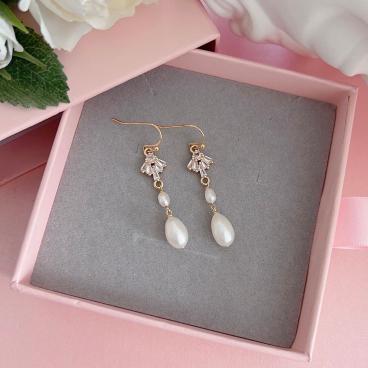 * DETAILS * - Natural Freshwater Teardrop Shape Pearls ✨more earrings. www.Etsy.com/shop/JinnysJewelryBySeJin ✨matching Y-necklace in the photo. https://www.etsy.com/JinnysJewelryBySeJin/listing/1259481767/14k-gold-filled-lariat-necklace-y-pearl?utm_source=Copy&utm_medium=ListingManager&utm_campaign=Share&utm_term=so.lmsm&share_time=1656801719929 👉🏻Please note that all Jinny's Jewelry pieces are crafted by hand and one-of-a-kind, and may therefore vary slightly in size and shape. ------------- Teardrop Clip-on Earrings For Wedding, Wedding Teardrop Clip-on Earrings, Dangle Pearl Drop Flower Earrings For Anniversary, Pearl Drop Dangle Flower Earrings For Anniversary, Elegant Teardrop Flower Earrings For Jewelry Making, Wedding Drop Earrings With Ear Wire, Anniversary Flower Dangle Earrings With Pearl Drop, Drop Earrings For Wedding With Ear Wire, Dainty Dangle Earrings For Wedding