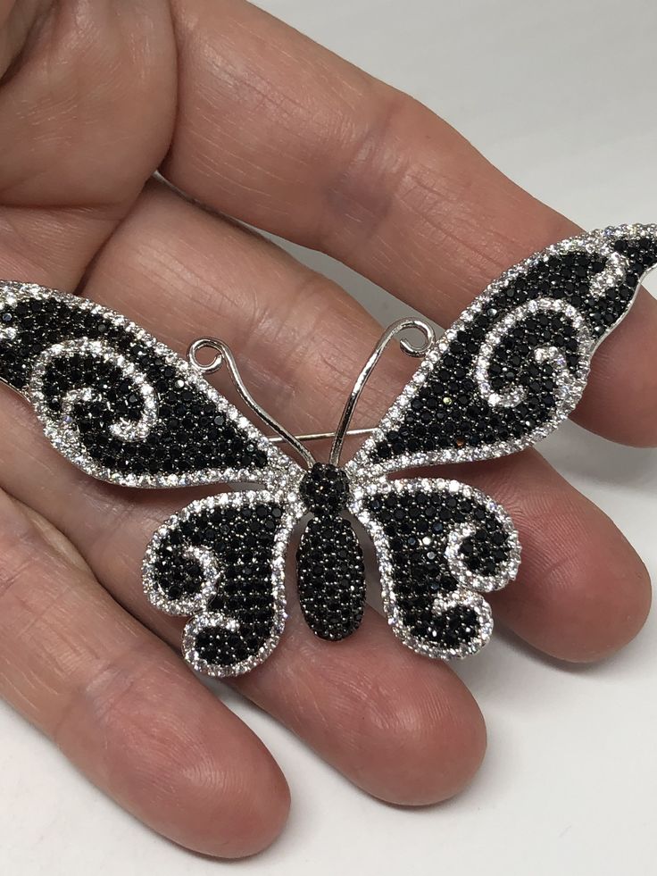 Vintage Black Crystal Gothic Styled Silver Finished Butterfly Broach Vintage casting pin 0ver 1.5 inches ornate Austrian crystal Butterfly with silver finish All jewelry is shipped free in the US in a nice gift box. Check out our over a THOUSAND great reviews Silver Crystal Brooches As Gift, Silver Crystal Brooches For Gift, Crystal Pins With Rhinestones For Gifts, Silver Rhinestone Brooches As Gifts, Silver Rhinestone Brooches For Gifts, Butterfly Brooch For Evening Wear, Evening Butterfly Brooch Jewelry, Black Brooch Jewelry Gift, Black Rhinestones Brooch For Gift