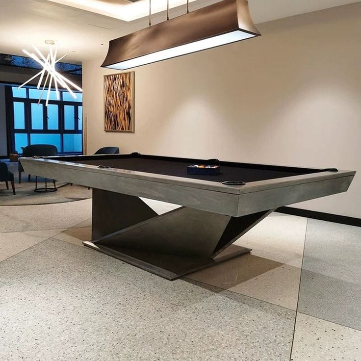 a pool table in the middle of a room