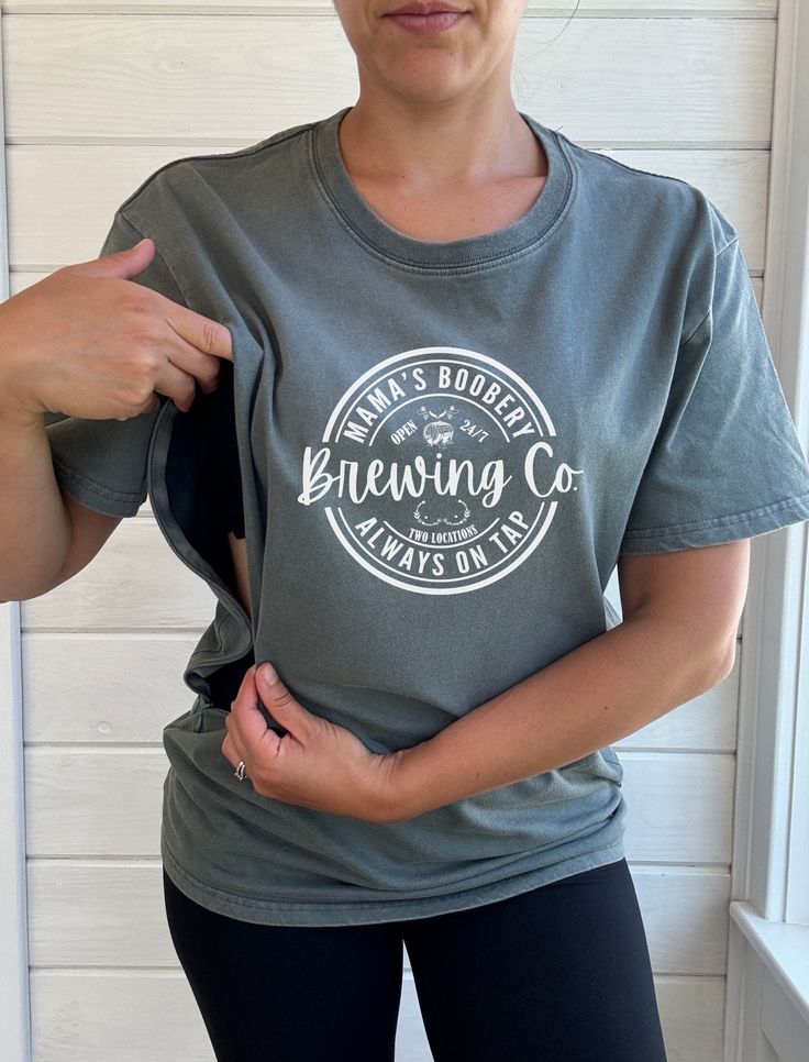 Our nursing friendly acid wash tees with Mama's Boobery Brewing Co. graphic is a game changer for breastfeeding mothers. All of our products are designed for comfort and convenience by a breastfeeding mother of three littles with functionality in mind. Made from 100% cotton and hand dyed, this t-shirt is lightweight and comfortable - perfect for warmer days to keep you cool. Great to be used for all seasons and is a loose fit style. Two convenient zippers on either side, easy to quickly zip open Nursing Friendly Outfits Summer, Nursing Friendly Clothes, Breastfeeding Shirts, Nursing Friendly Outfits, Nursing Friendly Tops, Breastfeeding Shirt, Breastfeeding Clothes, Farm Design, Denim T Shirt