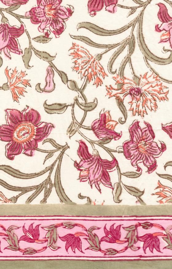 an embroidered fabric with pink flowers and leaves