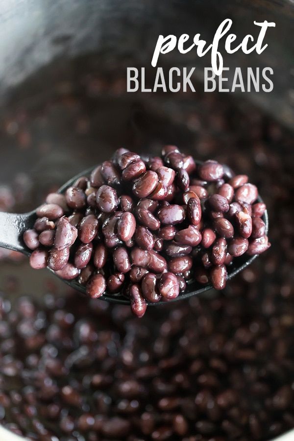 a spoon full of black beans with text overlay