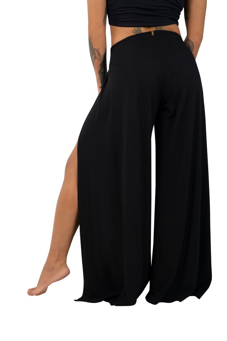 The Paris palazzo pants walk the line between covered and cool with a drapey wide leg and split front. These resort wear inspired wrap pants give your look a classy yet casual vibe that you can dress up or down depending on your mood or location. FEATURES: No fuss, stretchy & easy to pull on High front slits Flowy wide leg silhouette Mid rise Preshrunk Available size XS-3XL Crafted from 93% Lenzing certified TENCEL™ (a sustainable fabric made from eucalyptus trees) and 7% spandex (which we offse Split Leg Pants, Flowy Wide Leg Pants, Eucalyptus Trees, Wrap Pants, Split Legs, Walk The Line, Sustainable Fabric, Beach Pants, Boho Beach