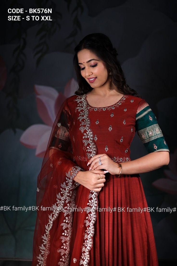 Experience the softness and comfort of cotton handloom fabric paired with a sparkling Green and red color combination. This half sleeve red piece is embellished with intricate gold maggam work in the yoke and sleeve. It features a matching net embroidered dupatta to complete the look. Celebrate the festival's love with this beautiful Anarkali set!* *Code-BK576N* *Size - S to xxl* *Anarkali Fabric: Cotton Handloom* *Dupatta Fabric: Net* *Work: Mirror and zardoshi Handwork* *Neckline: Round Shape Semi-stitched Gown For Navratri And Traditional Ceremonies, Navratri Maxi Length Gown For Traditional Ceremonies, Floor-length Gown With Dori Work For Diwali, Maxi Length Gown For Navratri Traditional Ceremonies, Navratri Traditional Ceremonies Maxi Length Gown, Floor-length Gown For Navratri And Traditional Ceremonies, Maxi Length Gown For Navratri, Floor-length Gown With Cutdana For Traditional Ceremonies, Semi-stitched Floor-length Gown For Traditional Ceremonies