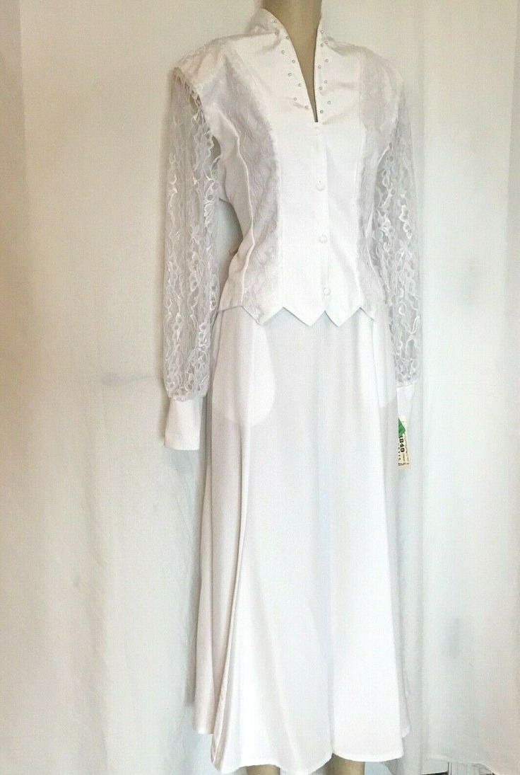 Western two piece, crop top, with light shoulder pads, and matching shirt with front pockets.  Trimmed in lace and pearl.  Skirt has waist band with back elastic and zipper, pockets and is 35" long. Regular $160.   Fits very big so please take your measurements and compare to the chart to order the correct size: Small = 35" Bust, 27- 29" Waist, 40" Hips Medium = 36" Bust, 30-32" Waist Skirt length = 35" Extra tops in size (3)XSmall (34" Bust) and (1) Medium(36" Bust) -  and skirts in size (2) La Pearl Skirt, Flair Skirt, Work Outfits Women, White Crop, Outfits Women, White Crop Top, Matching Shirts, Work Outfits, Waist Band