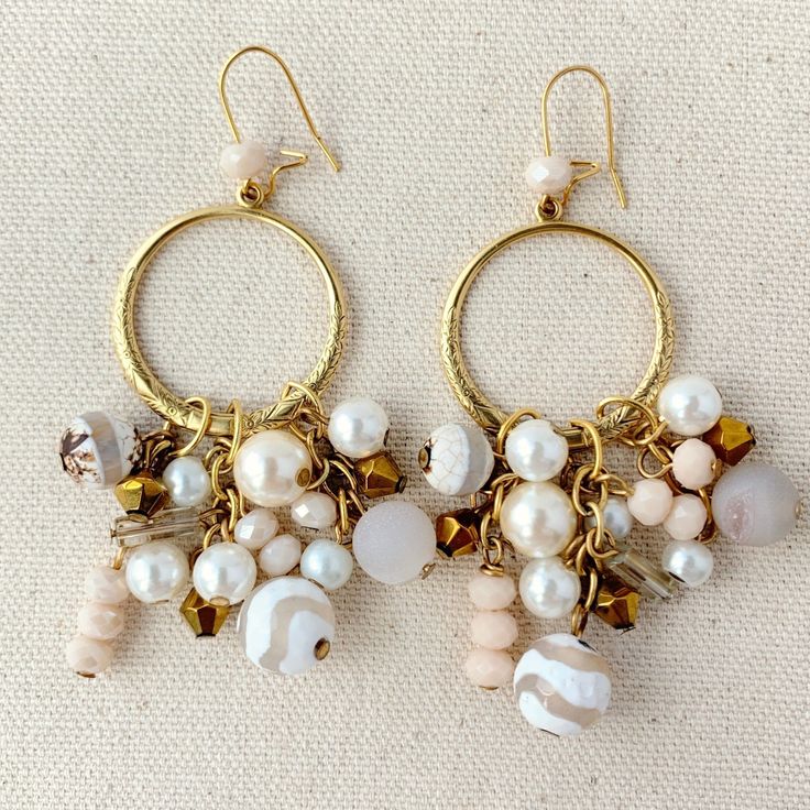 "Soft neutral tone beaded chandelier earrings with captivating and sophisticated boho chic style. Gold-plated brass hoops with detailed etched design anchor the glass and semiprecious stone beaded fringe. 1.25\"W and 3.5\" drop. Lightweight gold-plated, nickel-free ear wires. Handmade in USA. ~Semiprecious natural stones are exquisite metaphysical creations from earth where each one is unique in color, texture, shape and pattern. We make every effort to select stones that best match the website Beaded Dangle Chandelier Earrings, Bohemian Earrings With Pearl Drop And Round Beads, Bohemian Pearl Drop Earrings With Round Beads, Gold Bohemian Beaded Earrings With Pearl Drop, Artisan Beaded Dangle Chandelier Earrings, Bohemian Chandelier Earrings With Pearl Drop, Bohemian Chandelier Earrings With Natural Stones, Bohemian Chandelier Pearl Drop Earrings, Bohemian Gold Beaded Chandelier Earrings