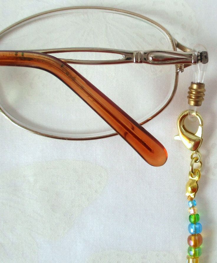 Never leave your reading glasses behind - use this yellow/multicolor beaded eyeglass chain! 24.5" in length, made with glass beads, beading cord, metal lobster clasps, and adjustable rubber holders. Lobster clasps make it easy to change the rubber holders, and an extra pair of holders included with every purchase. This bright yellow/multicolor beaded eyeglass chain will arrive in a gift box, ready to give as a present or to keep and store. Back to Beaded Eyeglass Chains Adjustable Colorful Beaded Jewelry For Everyday Use, Metal Beaded Necklaces With Lobster Clasp, Adjustable Metal Beaded Necklaces Nickel Free, Adjustable Czech Glass Beaded Necklaces With Lobster Clasp, Adjustable Metal Beaded Necklace Nickel Free, Adjustable Nickel-free Metal Beaded Necklaces, Metal Beaded Necklace With Adjustable Chain, Adjustable Beaded Chain Necklace For Everyday, Adjustable Gold Beaded Necklaces Nickel Free