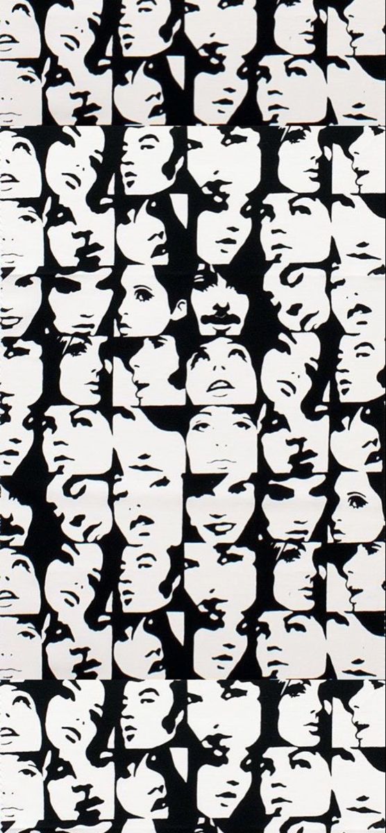 a black and white image of many faces