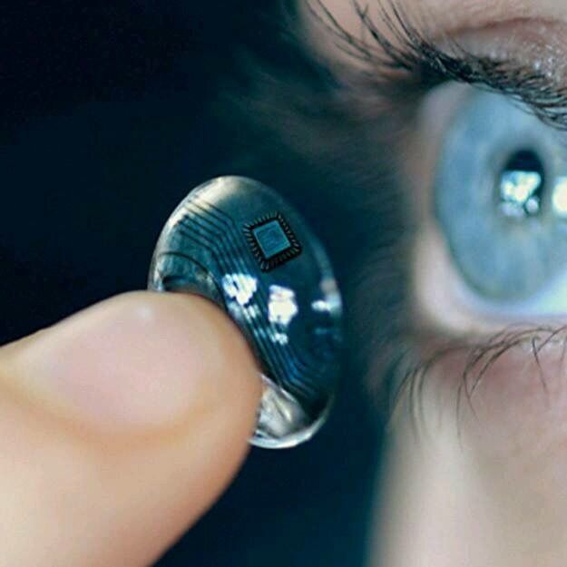 an eye looking through a magnifying glass to see what is in the reflection