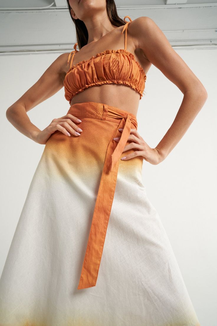 The SIGAL Wrap skirt is a staple resort wear piece. Fully adjustable and with an "A" shape silhouette, it can also be tied above the bust and worn as a dress. Wear as a cover up over your favorite bathing suit or pair with a crop top and sandals for a sophisticated, yet relaxed style. Handcrafted in 100% Cotton fabric, its body is made of one complete piece, the perfect canvas to strategically place the hand painted prints by SIGAL. Ties at waist. "A" line wrap skirt style. One size. It features Wrap Circle Skirt, Shape Silhouette, Yoga Style, Cami Nyc, Diy Clothing, Skirt Style, Cotton Linen Fabric, Solid & Striped, Bandeau Top