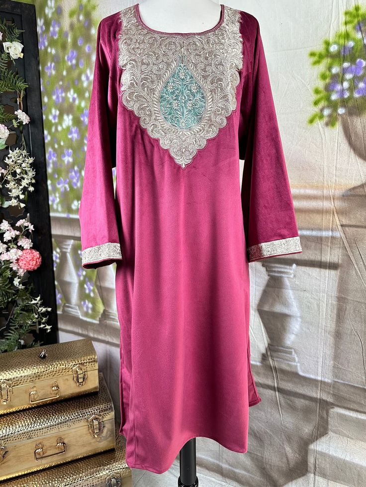 Tradition Kashmiri Velvet Pheran, a true embodiment of regal elegance. This exquisite piece features intricate Tilla work embroidery, adding a touch of traditional charm to the rich velvet fabric. Styled in a kurta silhouette, it seamlessly blends cultural heritage with contemporary fashion. The inclusion of side pockets enhances both functionality and style, making it a versatile addition to your wardrobe. Embrace the warmth and sophistication of Kashmiri craftsmanship with this meticulously cr Elegant Semi-stitched Churidar With Intricate Embroidery, Elegant Unstitched Embroidered Churidar, Elegant Unstitched Churidar With Intricate Embroidery, Elegant Embroidered Churidar With Traditional Drape, Elegant Embroidered Sherwani For Eid, Elegant Semi-stitched Embroidered Churidar, Elegant Embroidered Semi-stitched Churidar, Elegant Unstitched Jamawar Suit For Transitional Season, Elegant Straight Kurta With Dabka