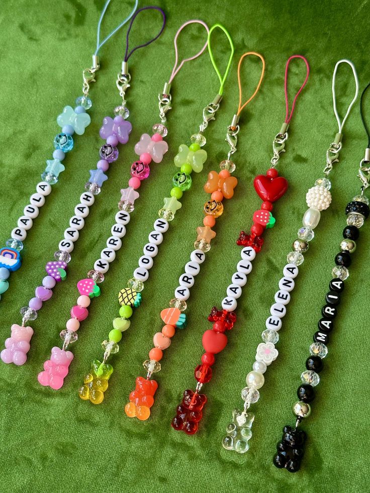 the charms are all different colors and have name tags on each beaded one side