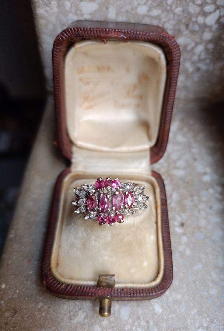 Metal : tested positive for Palladium Main gemstone: Ruby and diamond. Quantity of rubíes: 10 Cut: marquise and round cut Diamond: Quantity: 10 diamonds  Total diamond carat weight: 0.6 carats  Ring size: 7 Ring weight: 4.7 gr Stamped : no but we guarantee It Circas : 50's approx Formal Ruby Ring With Diamond Accents In Cluster Shape, Formal Cluster Ruby Ring With Diamond Accents, Marquise Cut Diamond White Diamond Ring, Formal Marquise Cut Gemstone Cluster Ring, Cluster Ruby Ring With Rose Cut Diamonds, Pink Marquise Cut Diamond Ring, Diamond Cluster Ruby Ring With Diamond Accents, Marquise Diamond Ring With 17 Jewels, Silver Marquise Ruby Ring For Anniversary