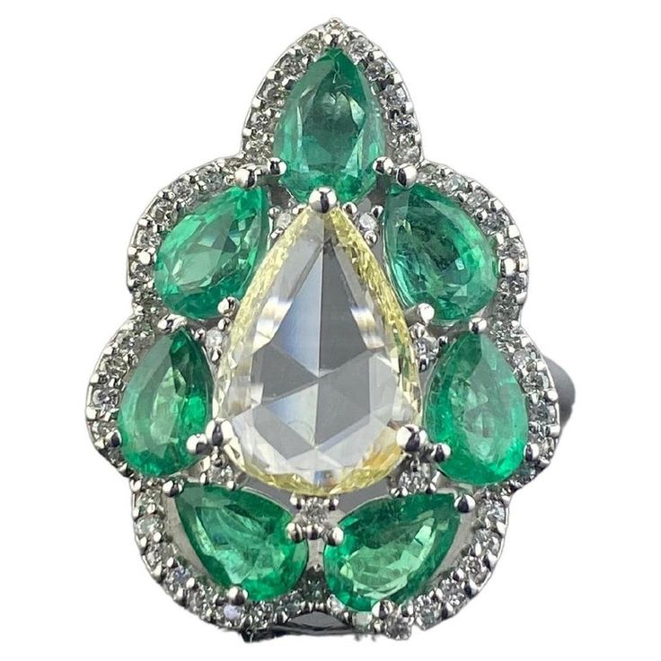 Luxury Green Teardrop-shaped Ring, Green Pear-shaped Diamond Ring, Teardrop Emerald Ring With Brilliant Cut, Pear-shaped Brilliant Cut Emerald Ring, Diamond And Emerald Engagement Ring, Contemporary Engagement Rings, Modern Engagement Rings, Sparkly Jewelry, Zambian Emerald