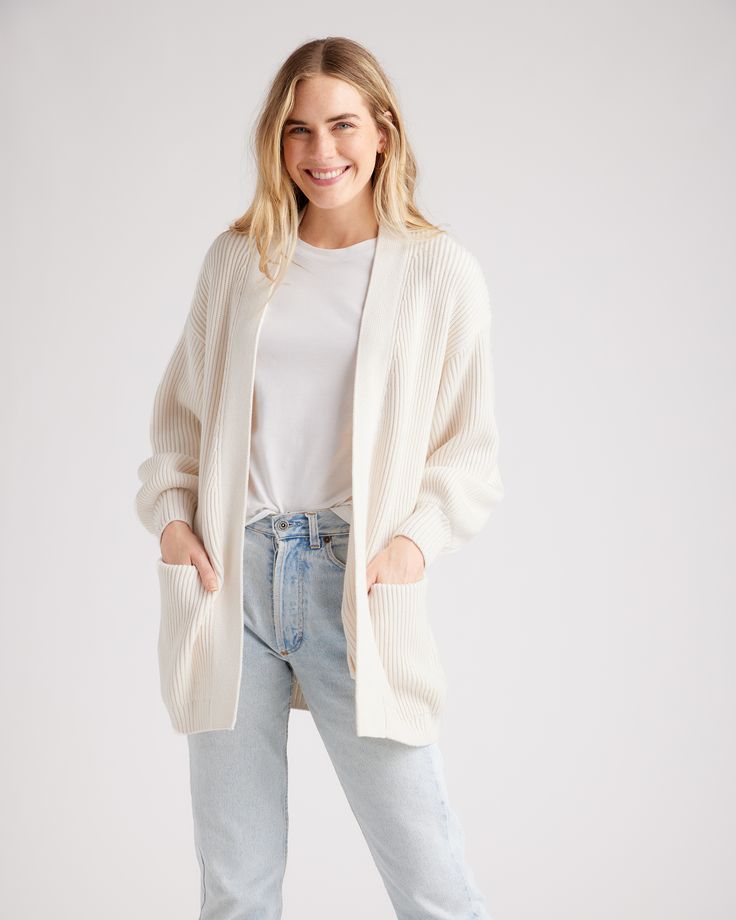 She's giving cozy evenings, busy days, chill vibes. Our fave organic cotton cardigan has dropped shoulders and lantern sleeves for a relaxed look—even if you're running about town. Roomy front pockets add to the coziness and functionality. We made her in a bit of an oversized fit so you can wrap up in soft supple cotton.  | Quince | Women's OverSized Cardigan Sweater in Ivory, Size Small, Organic Cotton Cream Cardigan For Everyday Fall Wear, Cream Cardigan For Everyday, Fall Season, Fall Cream Cardigan For Everyday Wear, Everyday Cream Cardigan For Fall, Everyday Soft Knit Relaxed Fit Cardigan, Relaxed Winter Sweater For Everyday, Relaxed Everyday Winter Sweater, Everyday Cream Soft Knit Cardigan, Relaxed Fit Soft Knit Cardigan For Daywear