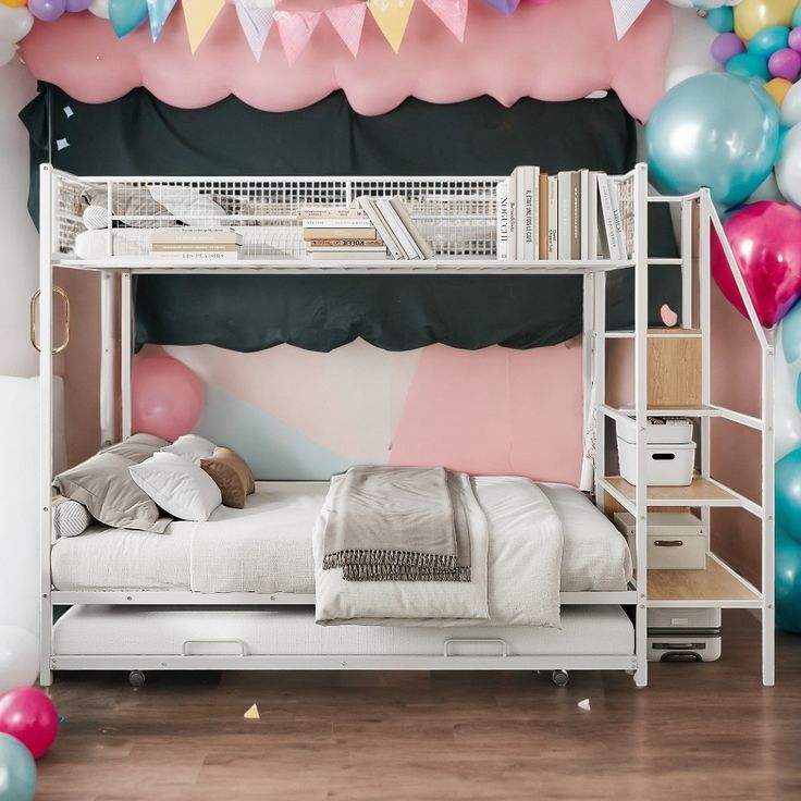 there is a bunk bed in the room with balloons on the wall and other decorations