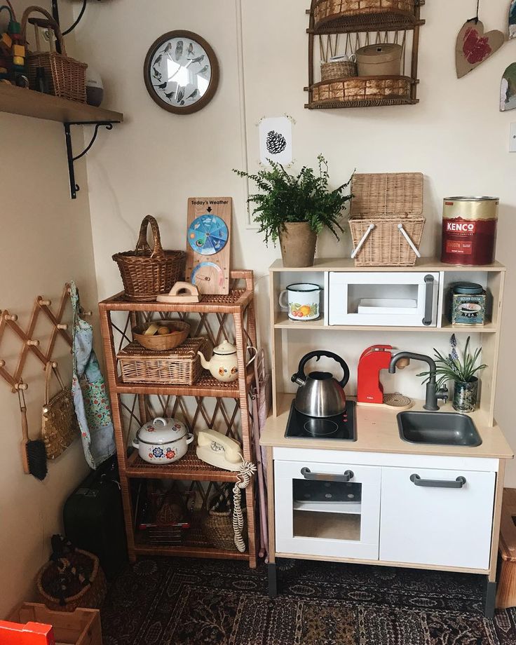 a kitchen area with various items on the shelves