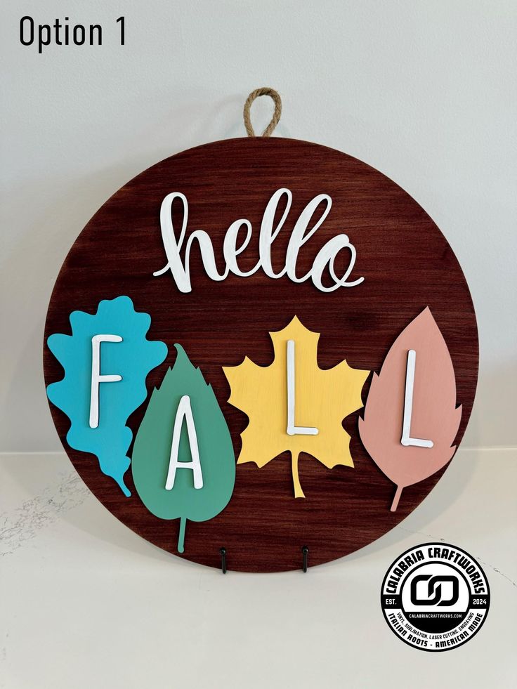 a wooden sign that says hello fall with leaves and the words hello fall on it