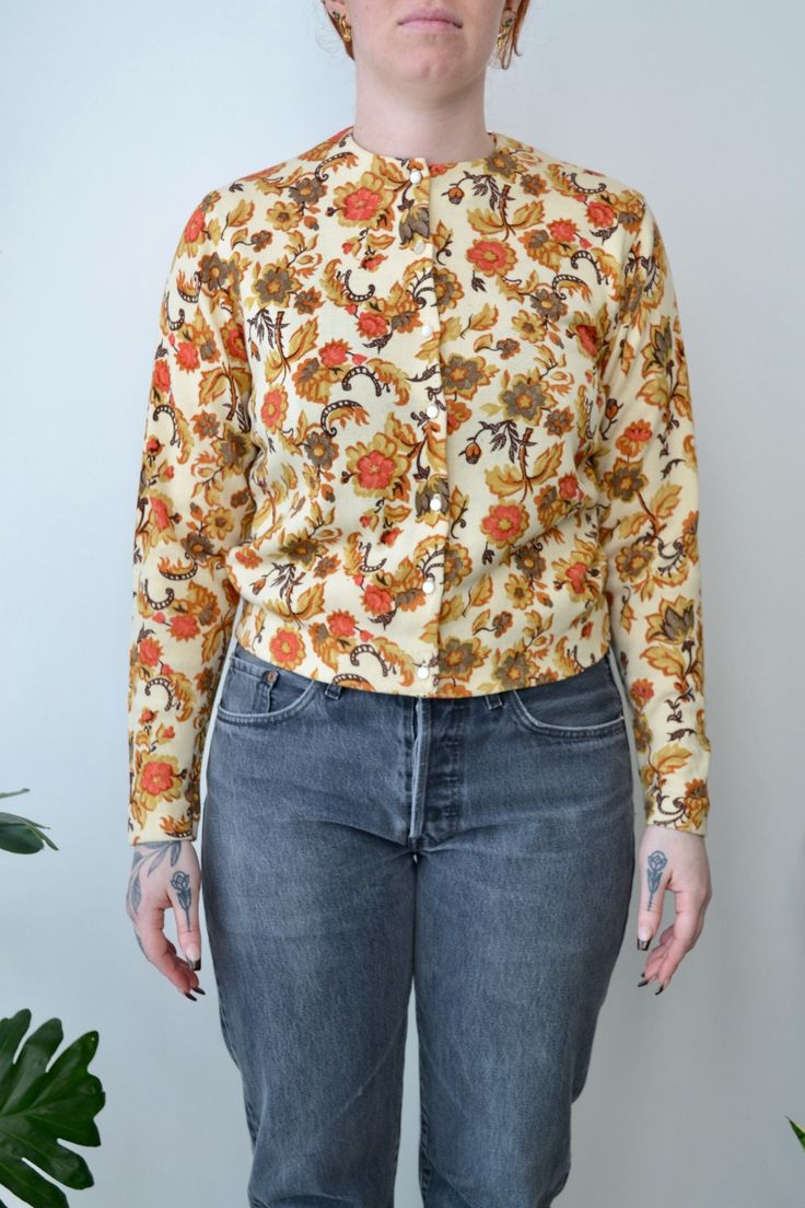 Fifties "Jantzen" Baroque Floral Cardigan. Button Closure in Front. Unlined. Made in USA No Content Label Tag Size 40 Excellent Vintage Condition - Tiny Marks All Measurements Taken Flat Pit to Pit-20" Waist-17.5" Shoulder to Shoulder-15.5" Sleeve Length-22.5" Shoulder to Hem-20.5" All Sales Are Final. We have taken the time to note all size measurements and the condition of each piece so please look over all the information of the garment you are considering purchasing. Please note that all ite Retro Fitted Button-up Cardigan, Fitted Button-up Retro Cardigan, Vintage Floral Print Spring Cardigan, Fall Button-up Blouse With Vintage Print, Fitted Long Sleeve Retro Cardigan, Vintage Long Sleeve Blouse With Covered Buttons, Vintage Floral Print Cardigan For Winter, Vintage Floral Print Winter Cardigan, Vintage Floral Print Winter Tops