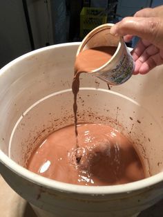 a person pouring chocolate into a white bowl