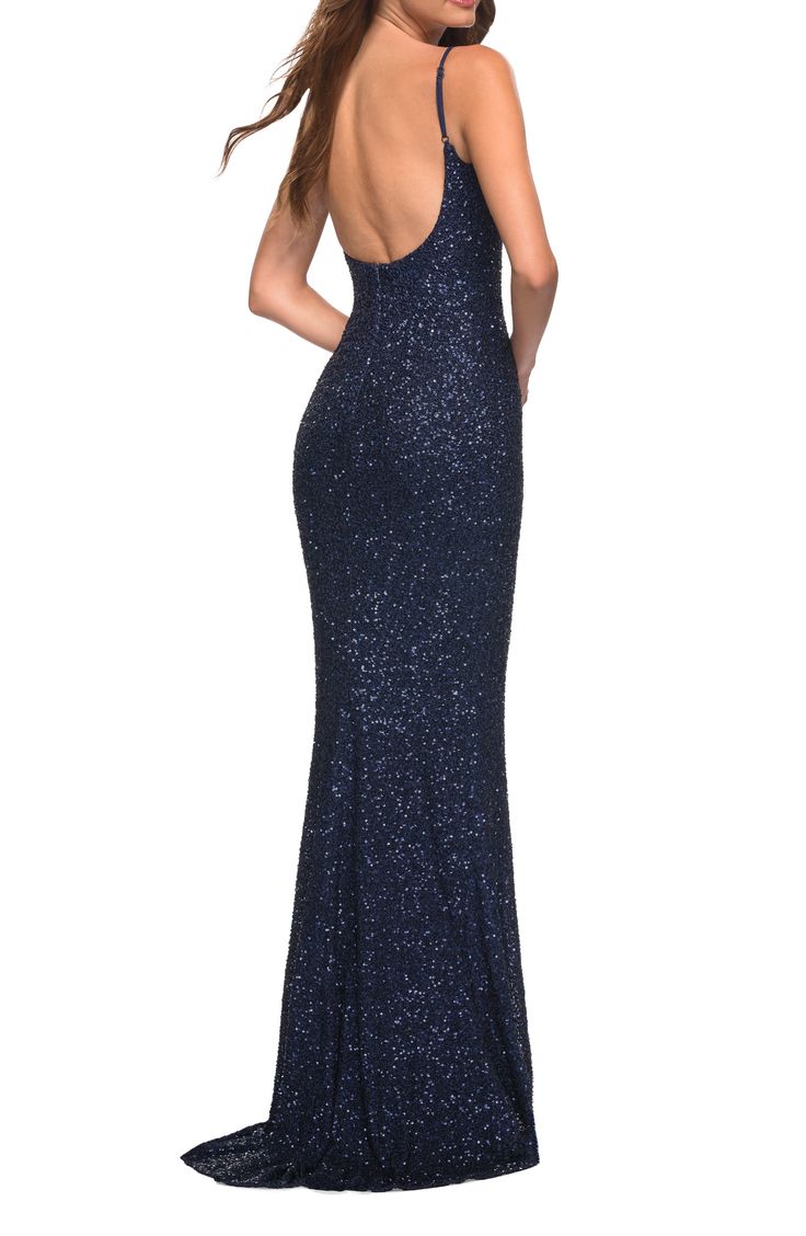 Iridescent sequins create a play of shimmering texture down the slinky length of an open-back gown sure to make a stunning statement. 60" length Scoop neck Adjustable straps Lined 100% polyester Spot clean Imported Sparkling Backless Evening Dress, Navy Blue Sparkly Dress, Blue Sparkly Dress, Navy Prom Dresses, Plastic Dress, Sequin Formal Dress, Trumpet Gown, Prom Dress Stores, Sequin Prom Dress