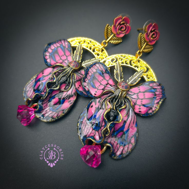 Amethyst Butterfly earrings in Art Nouveau style, made by high-quality colourful polymer clay, colours do not wash out and do not fade in the sun, decorated by Tourmaline Cabochons and beads. Single copy,100% Handmade OOAK earrings. All items are shipped from my home within 1-3 business days after payment confirmation. Please, contact me with any questions. I make some custom orders. If you would like some items to be custom made or created for you in a special way, feel free to send an Etsy con Artistic Hand Painted Polymer Clay Earrings, Pink Bohemian Resin Jewelry, Bohemian Pink Resin Jewelry, Bohemian Multicolor Hand Painted Flower Earrings, Bohemian Style Resin Flower Earrings As Gift, Handmade Multicolor Butterfly Earrings, Unique Purple Polymer Clay Earrings, Purple Hand Painted Bohemian Earrings, Artistic Polymer Clay Earrings For Pierced Ears