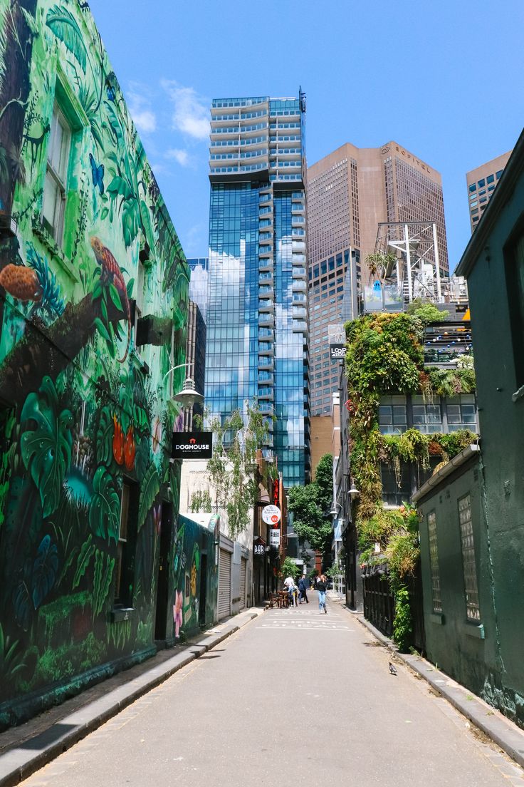 an alley way with buildings painted on it