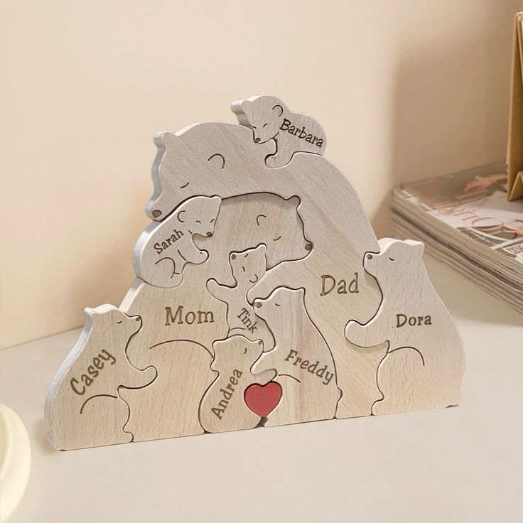 a personalized wooden bear family tree with two bears and a heart on the top