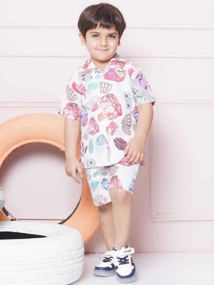 Stylish Abstract Design: - This set features a coordinated design with a matching shirt and shorts, creating a fashionable and put-together look for boys. - The abstract design ensures a hassle-free outfit choice and saves time when getting dressed. .Sales Package:- 1 Shirt & 1 Short  .Style:- Co-ord Set for kids Cotton Fabric: - Boys Co-Ord Set is crafted from cotton fabric, known for its softness, durability, and breathability. - Fabric provides a comfortable wearing experience, allowing for u Family Matching Cartoon Print Sets For Summer, Family Matching Sets With Cartoon Print For Summer, Summer Family Matching Sets With Cartoon Print, Family Matching Sets With Cartoon Print Short Sleeves, Summer Sets With Cartoon Print And Shorts, Playful Multicolor Printed Shorts, Casual Short Sleeve Playwear Set, Playful Cotton Sets For Beach Season, Pink Cotton Short Set For Beach