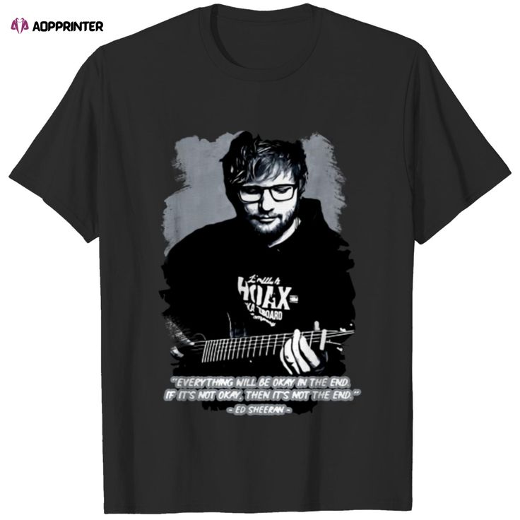 a black t - shirt with an image of a man holding a guitar in his hand