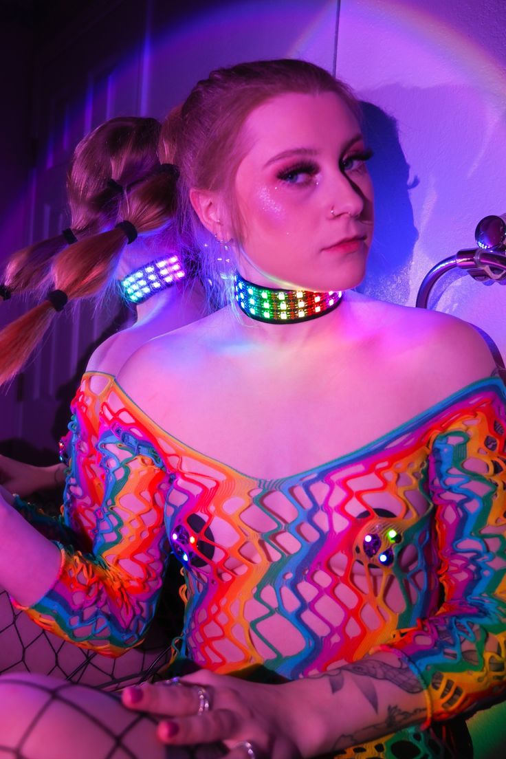 Expand your glow-filled wardrobe with the LED Choker Necklace. This colorful accessory features bright LED lights that respond to music, flashing and glittering to the beat of your favorite songs. Adjustable around your neck, this choker sits comfortably, and the battery pack fits comfortably on your back, so you hardly notice it's there. This quality-crafted sound-reactive LED Choker Necklace is a must for night concerts, festivals, and rave parties. It has bright, colorful lights that glitter Multicolor Rave Jewelry For Party, Rave Multicolor Choker For Festivals, Constellation Earrings, Everything Stays, Colorful Lights, Rave Party, Necklace Extender, Colorful Accessories, Bright Led Lights