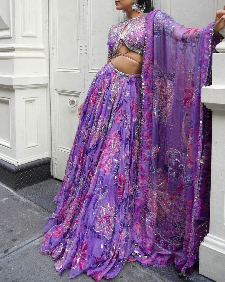 Embroidered Lehenga With Embroidered Blouse Featuring Our Signature Tie-up Detail Paired With A Dupatta.From Mahima Mahajan's Ishq collection. DELIVERY TIMEPlease allow 6-8 weeks for your outfit to arrive. FABRIC DETAILSOrganza Professional cleaning only. Festive Purple Palazzo Set With Floral Embroidery, Purple Embroidered Palazzo Set For Festive Occasions, Embroidered Purple Palazzo Set For Festive Occasions, Purple Floral Embroidery Palazzo Set For Wedding, Purple Palazzo Set With Floral Embroidery For Wedding, Wedding Purple Palazzo Set With Floral Embroidery, Purple Wedding Palazzo Set With Pallu, Purple Palazzo Set With Pallu For Wedding, Embroidered Purple Palazzo Set For Festivals