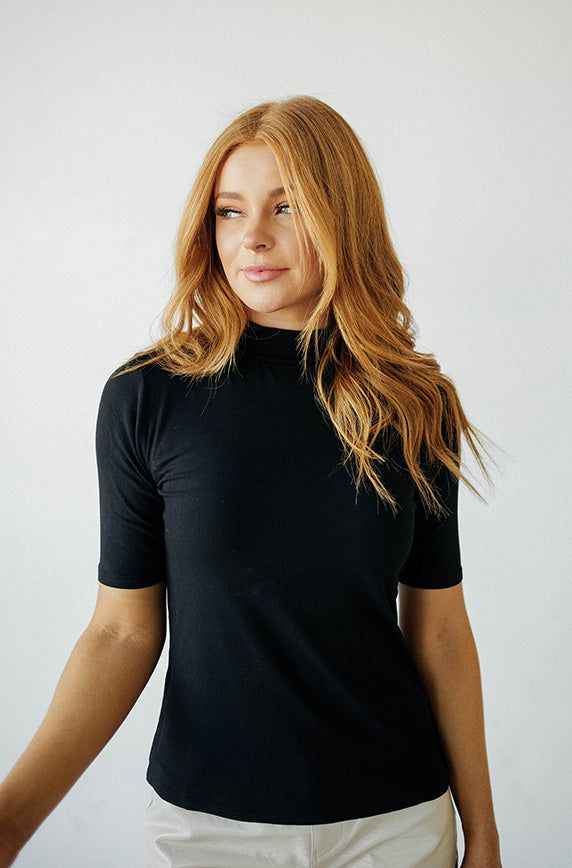 Your new favorite top is here & in a NEW Color! This top has everything you would ever need - stretch, comfort and coverage, you'll pair this top with all your favorite dresses, skirts, jeans and jumpers. Perfect for layering, our Ribbed Black MCO Top will match anything in your closet and give you the ability to create endless cute outfits! Product Fit + Details: Mock neck Stretchy material Elbow length sleeves Snug fit True to size Ribbed texture Great for layering Also available in: Taupe, Iv Modest Tops For Women, Tops For Women Black, Varsity Tees, Modest Tops, Skirts Jeans, Modest Bridesmaid Dresses, Taupe Leather, Leather Pant, Fit Details