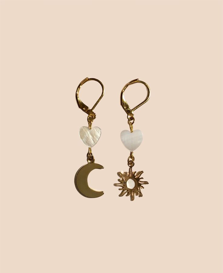 Cute hand-crafted boho earrings. Two 24k gold plated charms, two freshwater pearl hearts and 24k stainless steel gold plated studs pimp your ears up like crazy!  🌸 stainless steel ear studs, 24k gold plated  🌸 anti allergic  🌸 24k gold plated charms 🌙 🌞 moon and sun charms  🐚 real freshwater pearl hearts   This jewellery is your personal talisman. Shine your light with an individually and carefully handcrafted piece, that suits just YOU. You deserve to feel protected, safe and beautiful. T Dainty Handmade Gold Pearl Earrings, Dainty Gold Dangle Pearl Earrings, Handmade Bohemian Pearl Earrings As Gift, Handmade Dainty Gold-plated Pearl Earrings, Handmade Delicate Yellow Gold Pearl Earrings, Delicate Handmade Yellow Gold Pearl Earrings, Handmade Dangle Pearl Earrings In 14k Gold Filled, Handmade 14k Gold Filled Dangle Pearl Earrings, Handmade 14k Gold-filled Dangle Pearl Earrings