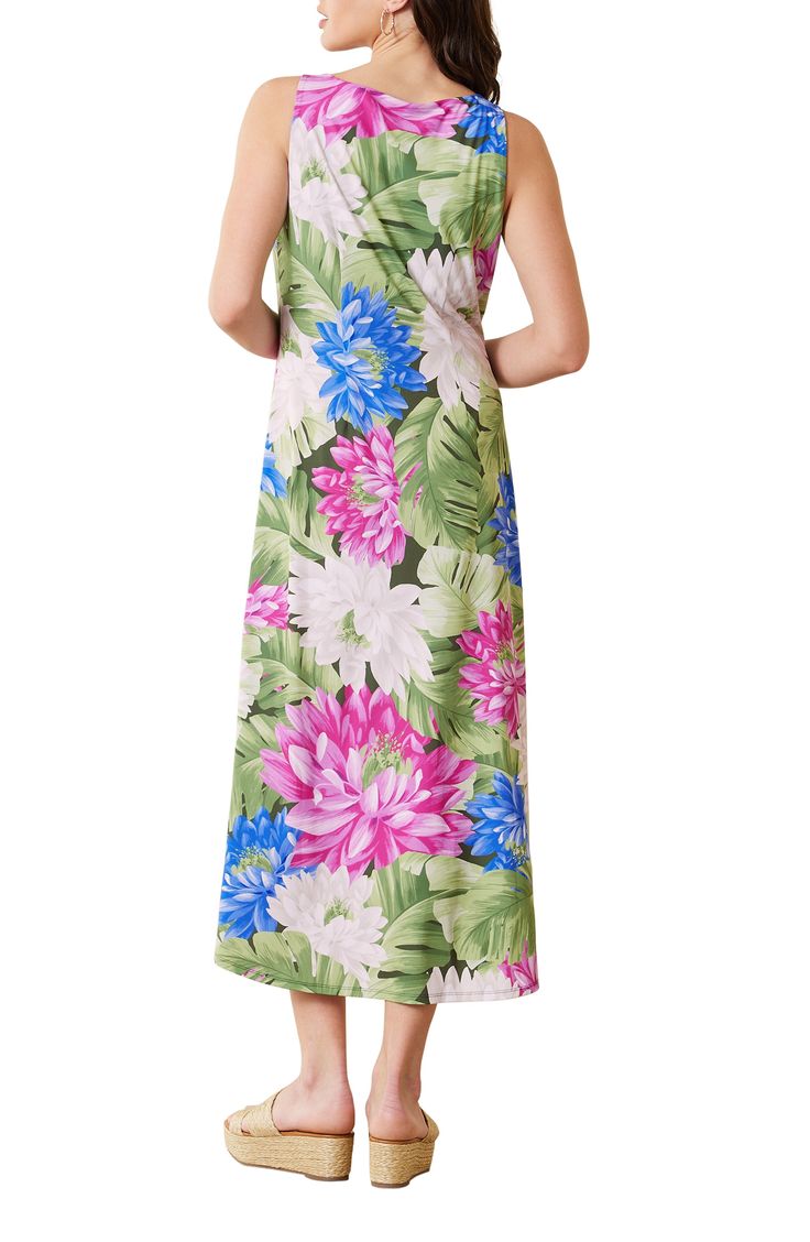 You'll definitely want to pack this soft and stretchy midi dress patterned in a vibrant floral print for your next sunny vacation destination. The easy fit and wrinkle-resistant fabric with built-in UV protection make it perfect for exploring in style. 49" length Slips on over head Jewel neck Sleeveless UPF 30+ sun protection Wrinkle resistant Unlined 95% recycled polyester, 5% spandex Machine wash, tumble dry Imported Multicolor Tropical Print Floral Dress For Vacation, Tropical Multicolor Midi Dress With Floral Print, Casual Multicolor Tropical Print Midi Dress, Casual Multicolor Midi Dress With Tropical Print, Tropical Multicolor Midi Dress With Vibrant Print, Multicolor Floral Print Midi Beach Dress, Multicolor Floral Print Midi Dress For Beach, Multicolor Printed Midi Dress For Vacation, Green Floral Print Vacation Dress