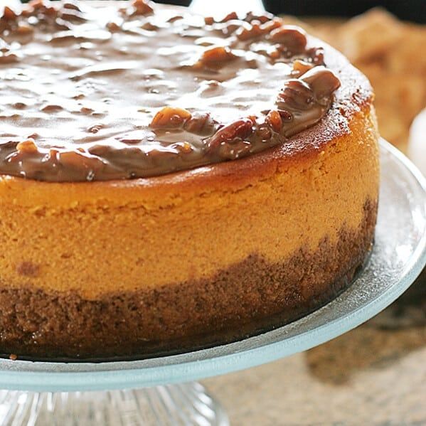 a cake with chocolate frosting sitting on a plate