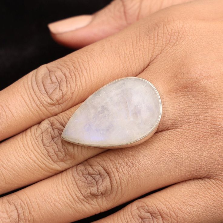 Rainbow Moonstone Ring, 925 Sterling Solid Silver Ring, June Birthstone Ring, Handmade Silver Jewelry, Natural Gemstone Ring, Wedding Gift    Gemstone Name - Rainbow Moonstone  Stone Quality - AAA  Weight - 14.5  gm  Ring Length - 3.8 cm Ring Width - 2.4 cm Stone Shape - As shown in the picture Ring Size - All Ring Size Available  We serve complete 925 sterling silver Jewelry and genuine properties of the stone.  The products are dispatched from the small business from UK. Product Quality and Packaging - Our all products are 925 Silver Stamped which shows that the product is genuine and authentic .The products are dispatched from the small business from UK so you get the product on time and the product packaging comes in bubble foil wrap with all the precautions taken primarily that your p White Opal Moon Shaped Ring With Gemstone, White Gemstone Teardrop Ring, White Moon-shaped Opal Gemstone Ring, White Teardrop Gemstone Ring, White Moon Shaped Opal Gemstone Ring, Minimalist Moonstone Ring With Natural Stones For Wedding, Minimalist Moonstone Ring For Wedding, Wedding Teardrop Moonstone Ring In Sterling Silver, White Crystal Ring With Stones For Anniversary