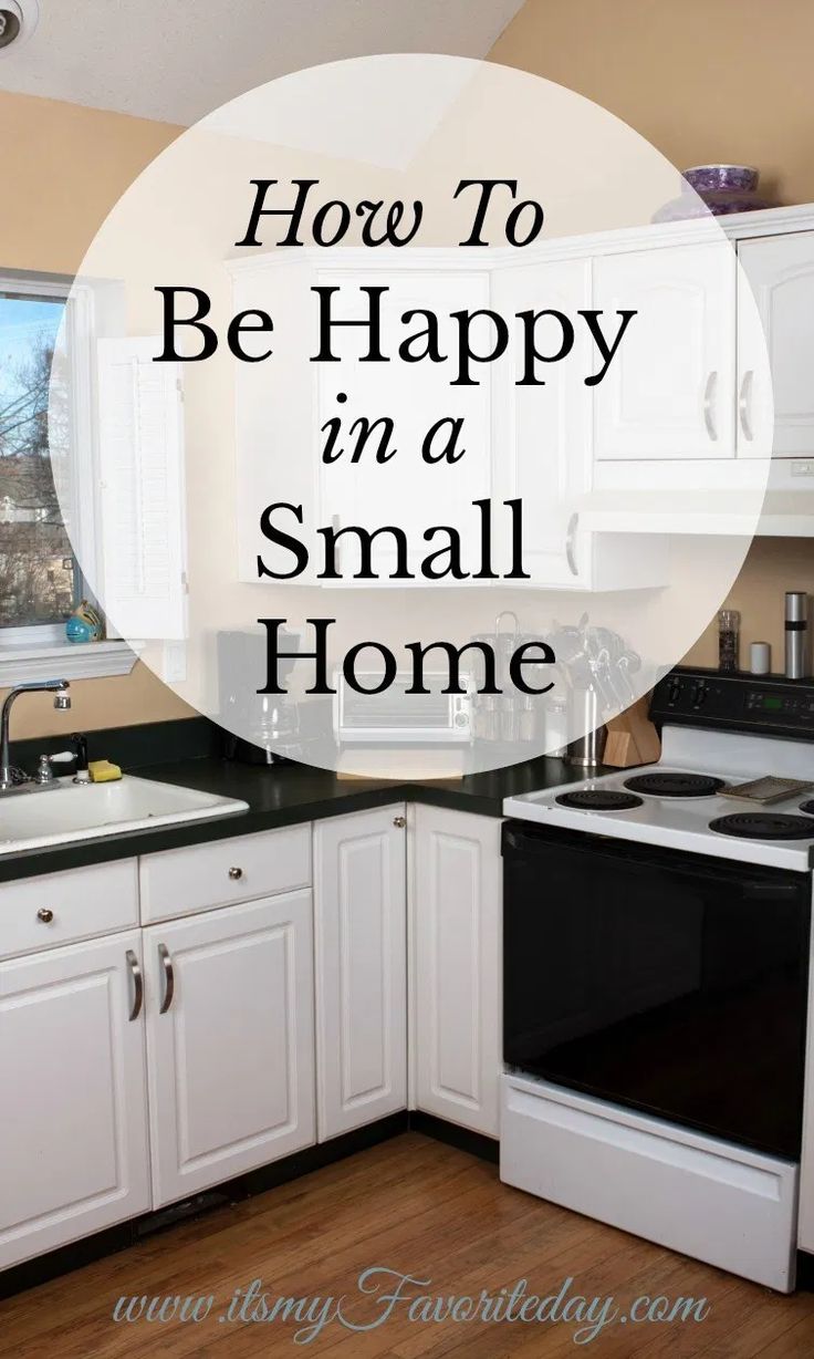 a small kitchen with white cabinets and black counter tops, the words how to be happy in a small home